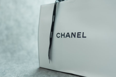 Bangkok, Thailand - July 22, 2024 : A proper packaging gift bag by famous brand Chanel with a black...