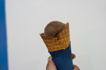 Chocolate ice cream in a waffle coneの写真素材