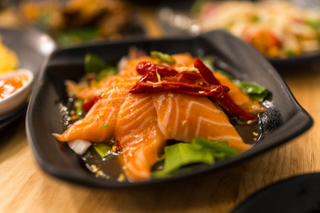 Spicy salmon salad, Thai cuisine Yum traditional spicy hot salmon.の写真素材