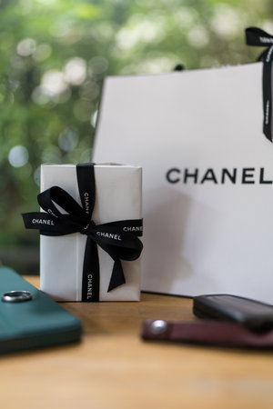 Bangkok, Thailand - August 12, 2024 : An elegant gift box by Chanel, proper packaging showing the brand on the ribbon. Perfect for Valentine day or christmas.のeditorial素材