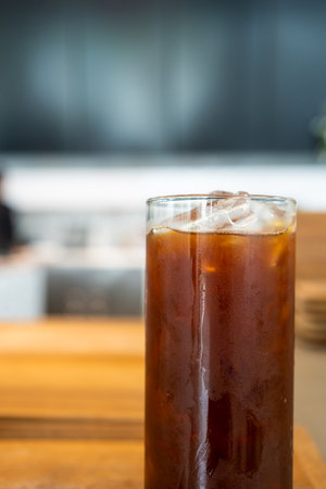 Iced black coffee in a tall glass. Cold summer drinkの写真素材