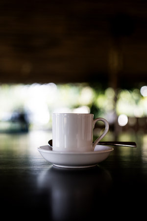 A ceramic cup of coffee cup and saucer on tableの写真素材