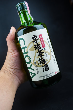 Bangkok, Thailand - August 17, 2024 : CHOYA Uji Green tea UMESHU. A straight-type Umeshu cold-brewed with Uji tea leaves. Perfect to enjoy during a meal. Volume 720mlのeditorial素材