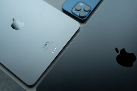 Bangkok, Thailand - August 17, 2024 : iPad Air M2 and Macbook Pro with iPhone 15 pro. The concept of the apple products.のeditorial素材