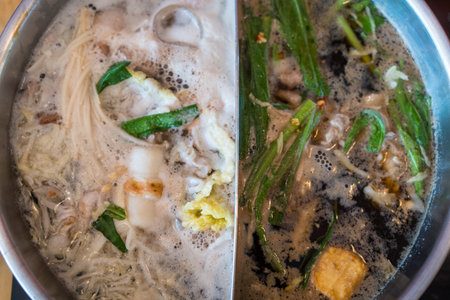A boiled dish of meat and vegetables and many food in Shabu shabu potの写真素材