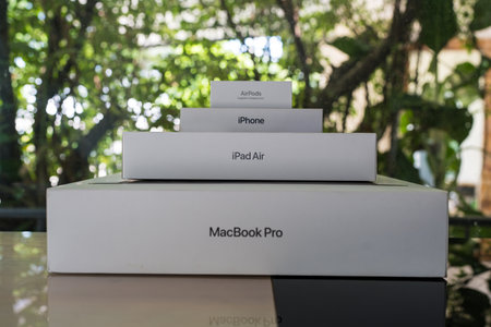 Bangkok, Thailand - September 8, 2024 : 
Boxes from Apple placed like a pyramid include Macbook Pro, iPad Air, iPhone, and AirPods against nature background. The concept of Apple company devices.のeditorial素材