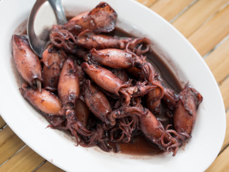 Squid black or Sauteed black squid is processed squid that is cooked until the squid ink is...