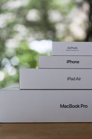 Bangkok, Thailand - September 12, 2024 : Apple products boxes include Macbook Pro, iPad Air, iPhone, and AirPods against nature backgroundのeditorial素材
