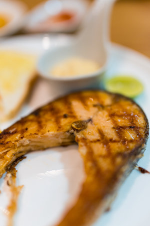 Plate of baked salmon steak. Selective focusの写真素材
