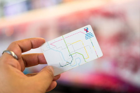 Bangkok, Thailand - September 21, 2024 : Hand shows a BTS Ticket. BTS Skytrain or The Bangkok Mass Transit System running in Bangkok. BTS Route has been designed to help people discover Bangkok.のeditorial素材