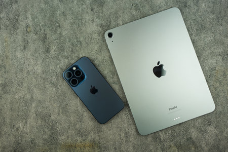 Bangkok, Thailand - October 4, 2024 : iPad Air and iPhone 15. Created by Apple Inc.のeditorial素材