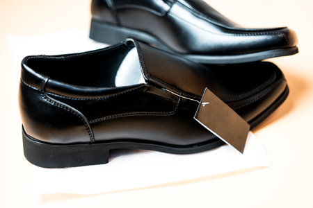 New black male footwear with black tagの写真素材
