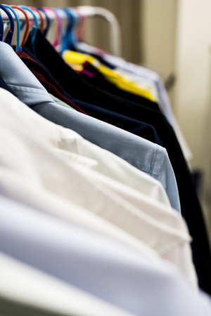 Hangers with clothes at home or in a store. clothes on a hanger.の写真素材