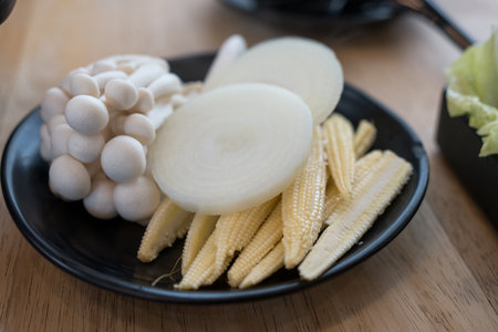 Set of fresh raw vegetable for shabu shabu on wood tableの写真素材