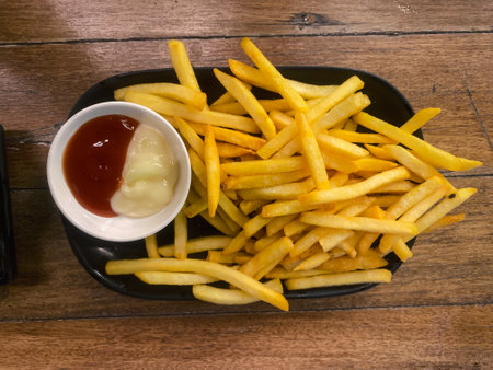 Directly above shot french fries with ketchup and mayonnaiseの写真素材