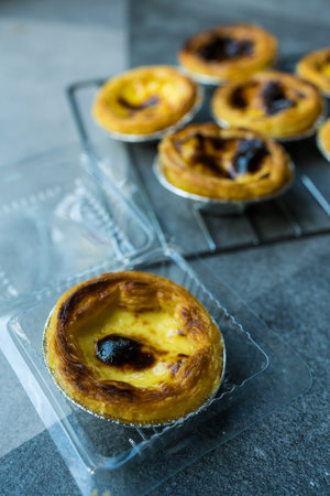 Dessert egg tart or portugal egg tart sweet custard cream    in box. Selective focus.
