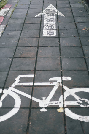 Bike lane street. A white bicycle symbol on the road.の写真素材