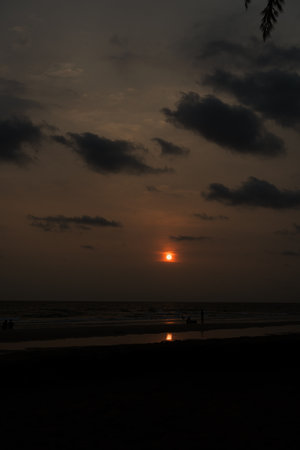 Landscape with sea sunset on the beach with family playing water at Thailandの写真素材