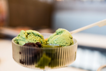 A bowl of green tea or matcha ice cream with sweet red beanの写真素材