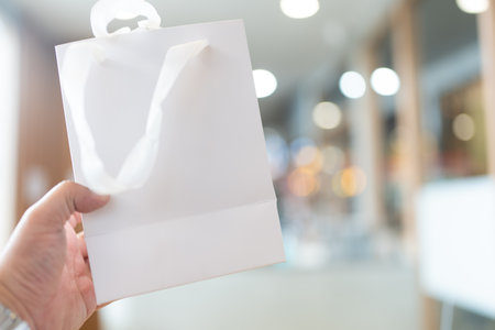 Empty shopping bag for branding, white paper bag,  fabric handlesの写真素材
