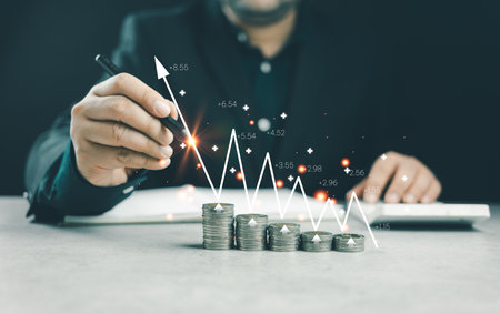 Interest rate and dividend concept. Businessmen calculate income and return on investment Interest rate and dividend concept. The Businessman is calculating income and return on investmentの写真素材
