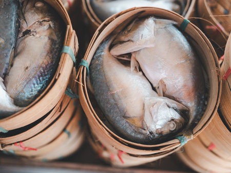 Group of mackerels in bamboo basket container at the marketの写真素材