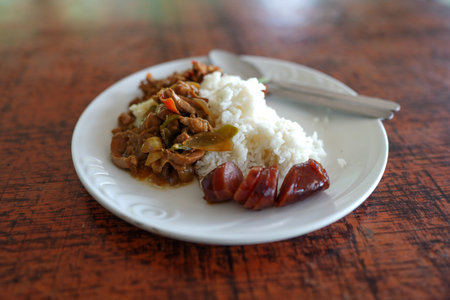 Thai food served with rice and chinese sausages on white dish. Southern of Thailand foodの写真素材