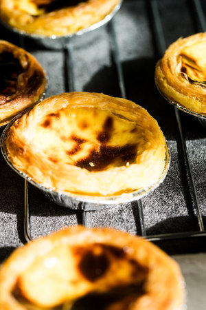 Delicious baked egg custard tarts fresh from the ovenの写真素材
