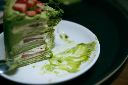 Pieces of cake matcha green tea cake after eatingの写真素材