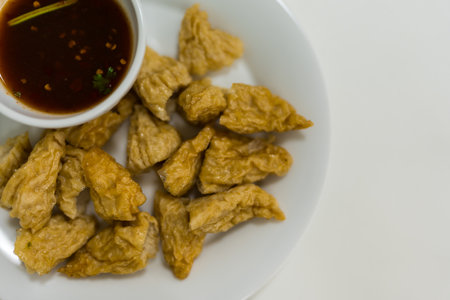 Fried fish balls served with simmered sugar dipping sauce with chili, Thai appetizer. Top viewの写真素材
