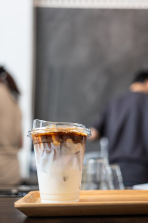 A glass of iced latte coffee in coffee shop