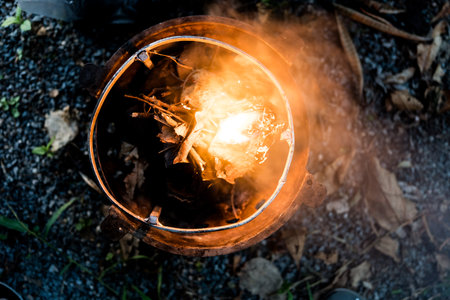Dry leaf in stove igniting barbeque fire. Top viewの写真素材