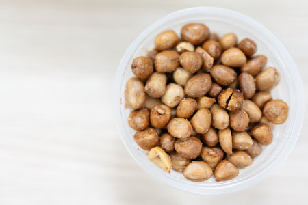 Roasted peeled peanuts mix salt in boxの写真素材