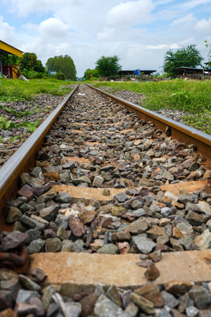Closeup of the railroad tracks stretching into the distance