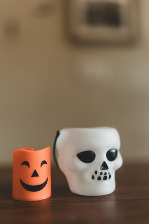 White skull with Halloween candle design, perfect for Halloween decor or artistic home ambiance.