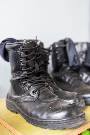 Leather combat shoes with laces on shelfの写真素材
