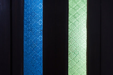 Mosaic glass on window, seen through windowの写真素材