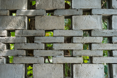 Bricks stacked on the wall, decoration for garden wall. Close upの写真素材