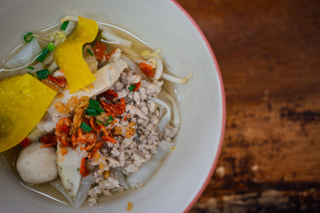 Noodle soup with wide noodles in bowl