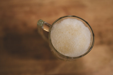 Top view of mug of frozen beer with foamの写真素材
