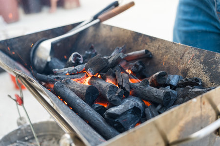 Glowing charcoal in grill. Burning charcoal on barbecue grill
