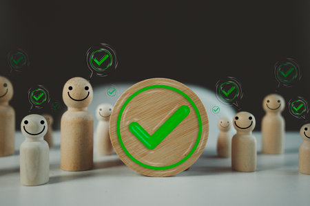 Green colored check mark in circle frame wood block with many people check mark in speech bubble. Approval, or verification.の写真素材