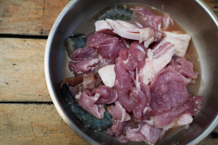 Close up fresh marinated pork and fresh peeled shrimp marinated set of ingredients for Thai style barbecue grilledの写真素材