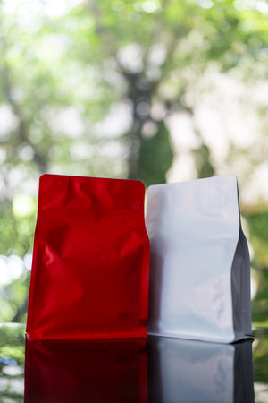 Red and white coffee bag packaging mockup, suitable for branding, mockup for marketing, mockup for packaging.の写真素材
