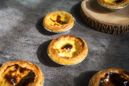 Egg custard tart dessert on white plate, traditional Portuguese dessertの写真素材