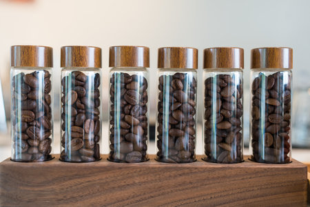 Close up shot of coffee beans in a shot glass for test