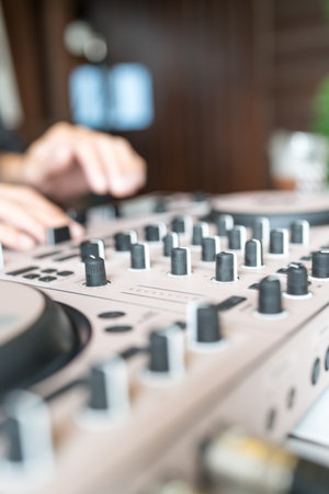 Close up of audio mixer with blur background Man using mixing console