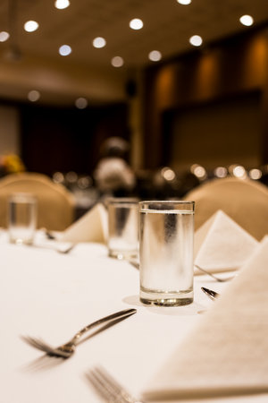 Close up of glass of cool water on the table setting in the event at hotelの写真素材