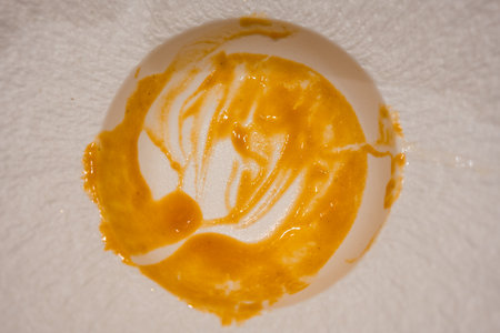 Empty plate with stains of orange sauce after finishing. Top view