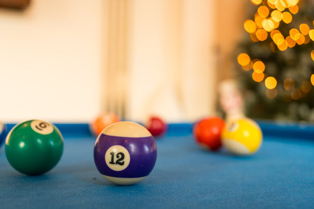 Balls on billiard blue cloth table. Shallow depth of field